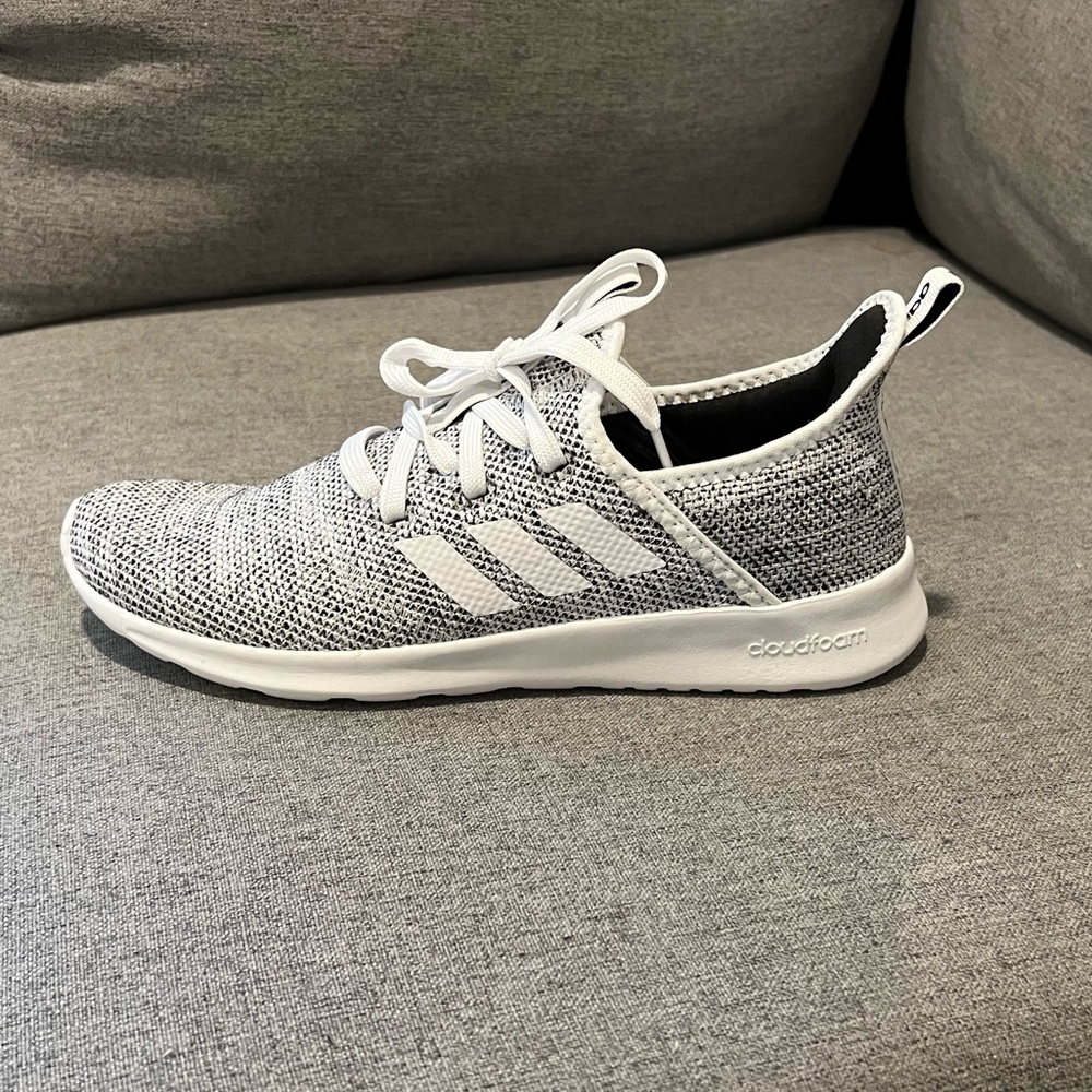 Adidas running sneakers. Never worn. Still in the box.